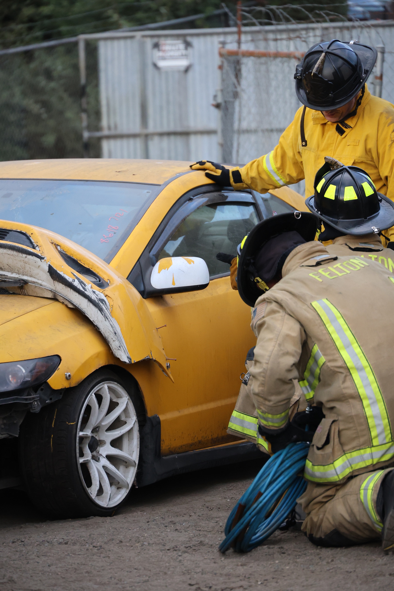 Crews set up on a training vehicle to practice creating access to a trapped patient.A